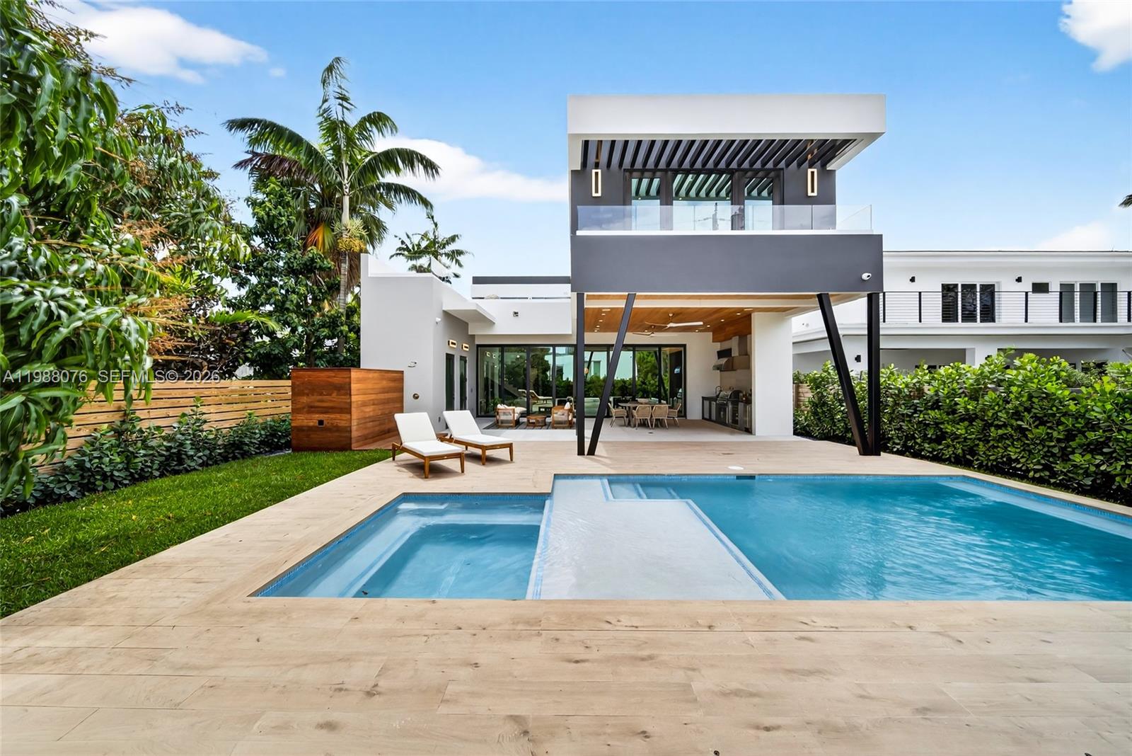 609 Southwest 24th Road Miami, FL 33129 - Photo 19 of 50 a view of swimming pool with seating space and trees in the background