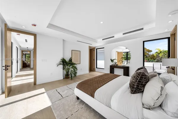 a view of hallway with livingroom and furniture