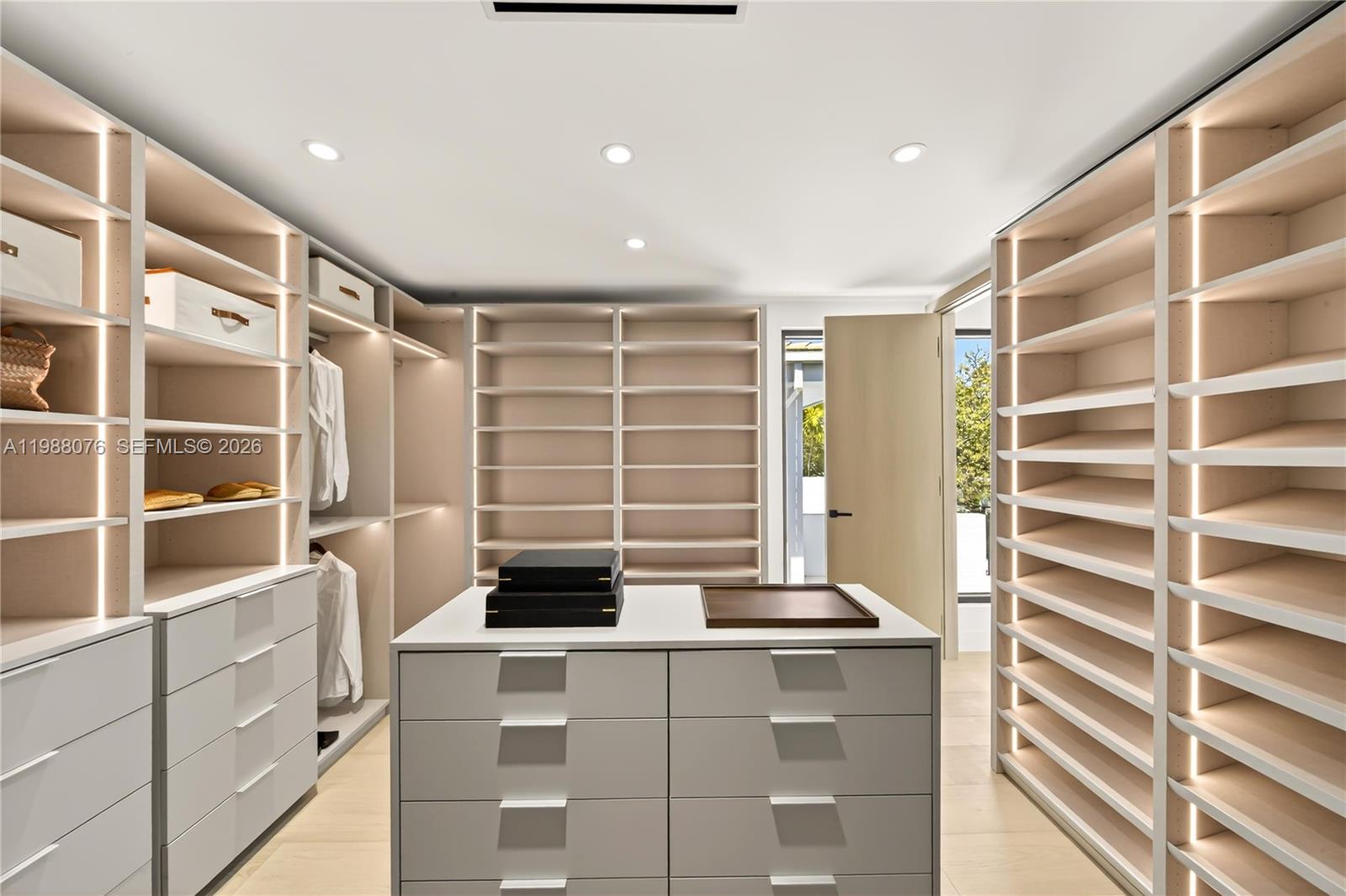 609 Southwest 24th Road Miami, FL 33129 - Photo 27 of 50 a view of walk in closet with empty racks