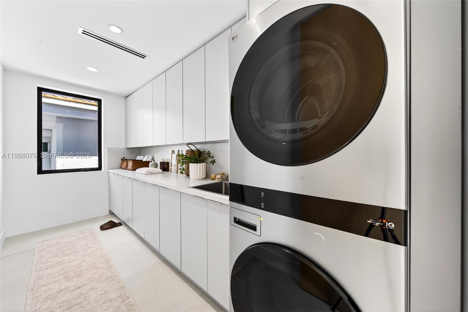 609 Southwest 24th Road Miami, FL 33129 - Photo 39 of 50 a kitchen with a washer and dryer