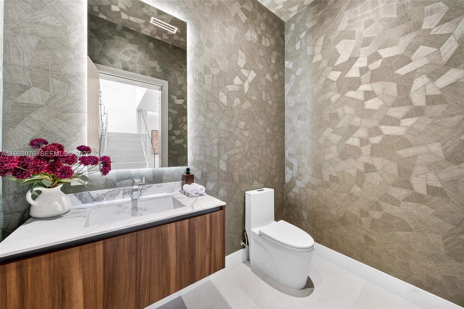 609 Southwest 24th Road Miami, FL 33129 - Photo 42 of 50 a bathroom with a sink mirror and toilet