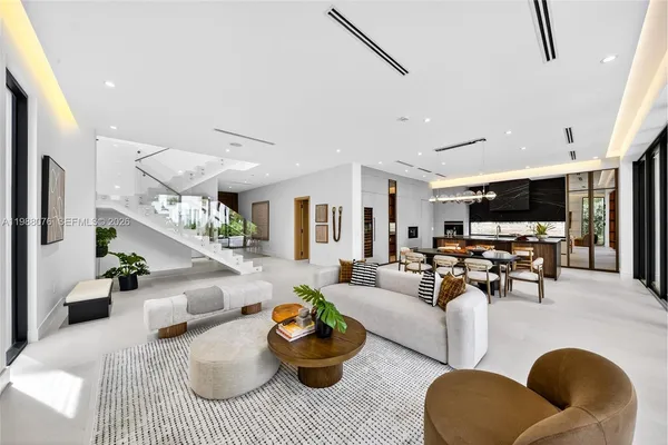 a view of a house with sitting area and a park