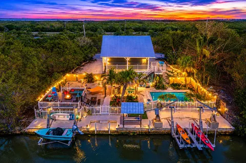 a view of swimming pool with a yard and a deck