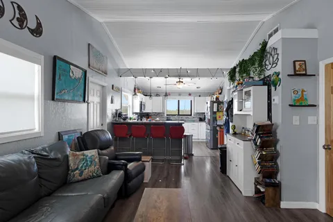 a kitchen with stainless steel appliances granite countertop a refrigerator and a stove