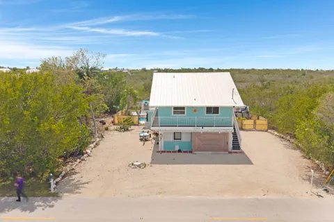 a aerial view of a house with a yard