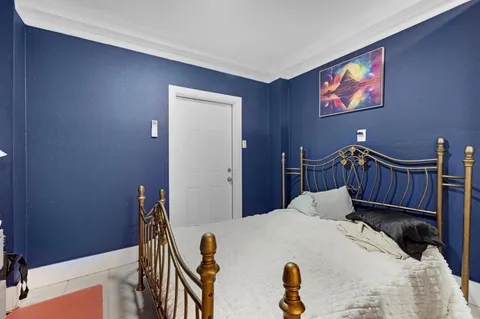a bed room with a bed and a window