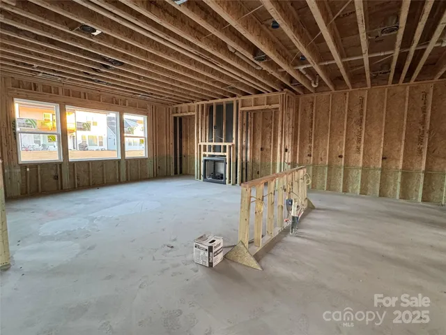 a spacious bathroom with a shower sink and mirror