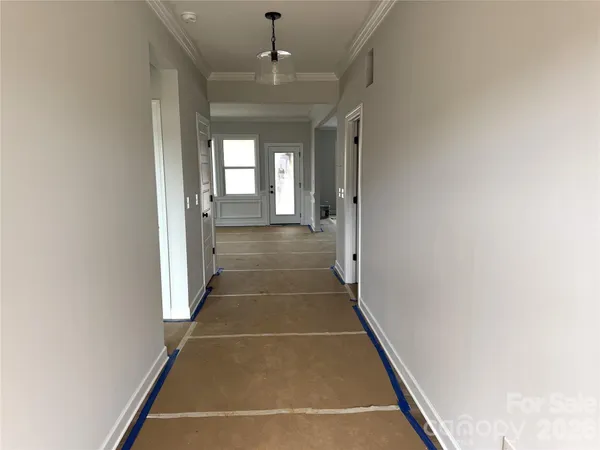 a view of a hallway with a chandelier