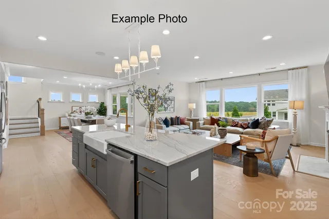 a view of a living room and kitchen