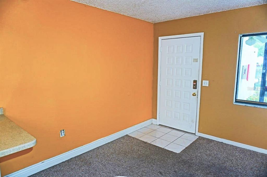 1865 Mazo Manor Road, Unit J5 Lutz, FL 33558 - Photo 11 of 23 an empty room with windows