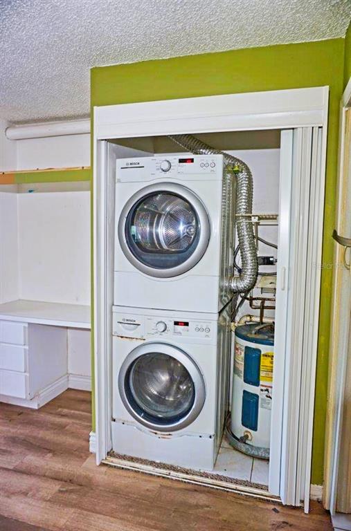 1865 Mazo Manor Road, Unit J5 Lutz, FL 33558 - Photo 18 of 23 a utility room with dryer and washer