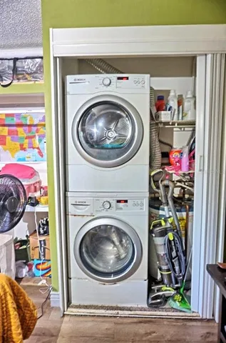 a view of a livingroom with furniture and chandelier fan