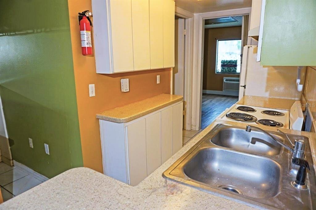 1865 Mazo Manor Road, Unit J5 Lutz, FL 33558 - Photo 4 of 23 a kitchen with a sink and a stove