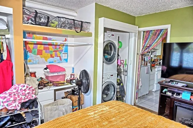 a view of a bedroom with a bed and toys