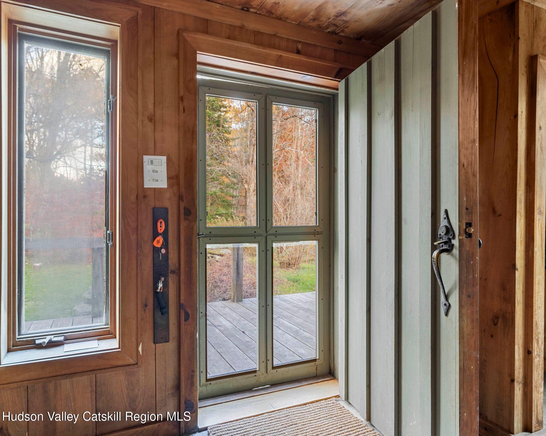187 Beaver Hill Road Conesville, NY 12076 - Photo 18 of 79 a view of a glass door with a glass door