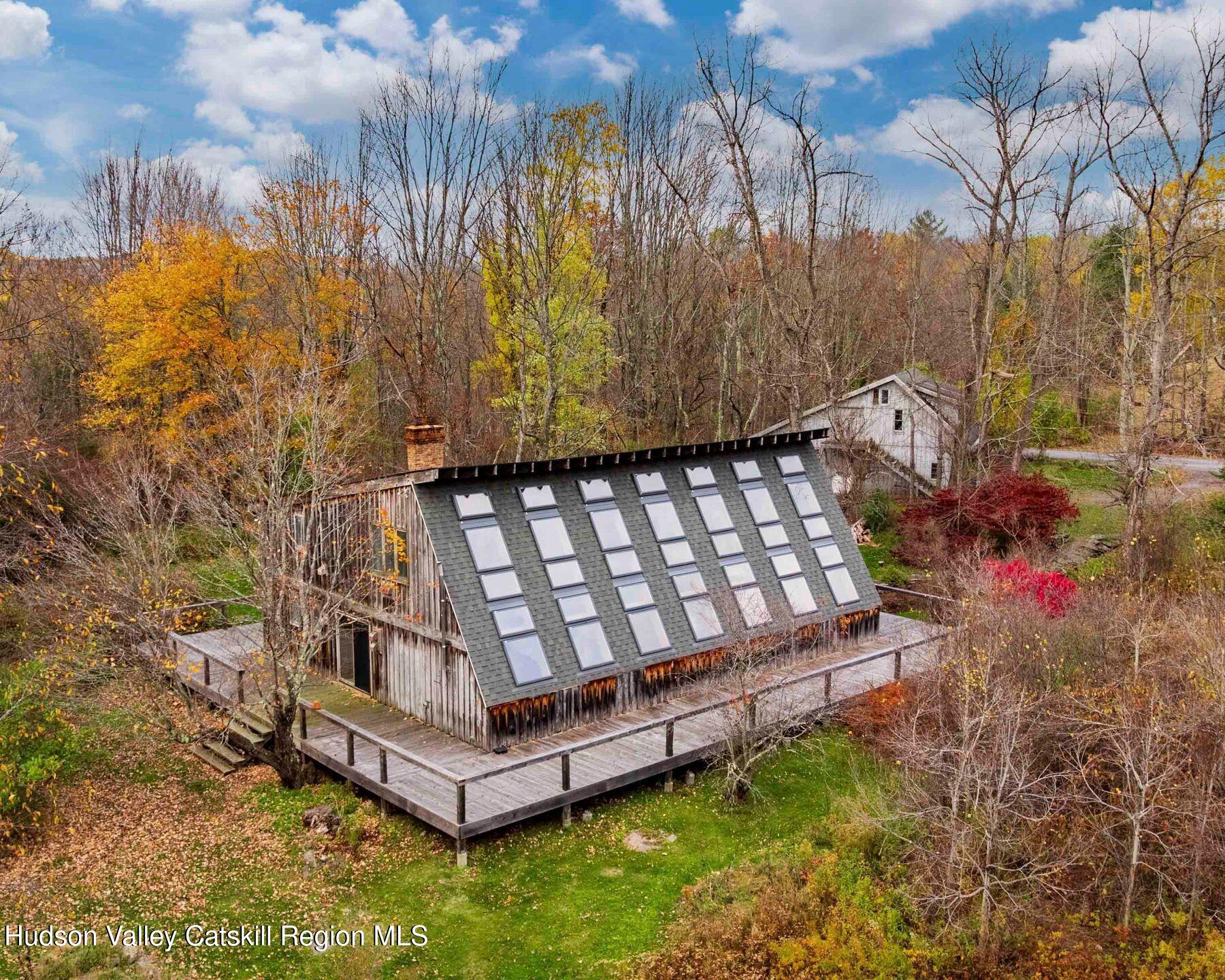 187 Beaver Hill Road Conesville, NY 12076 - Photo 2 of 79 a view of a backyard with wooden fence