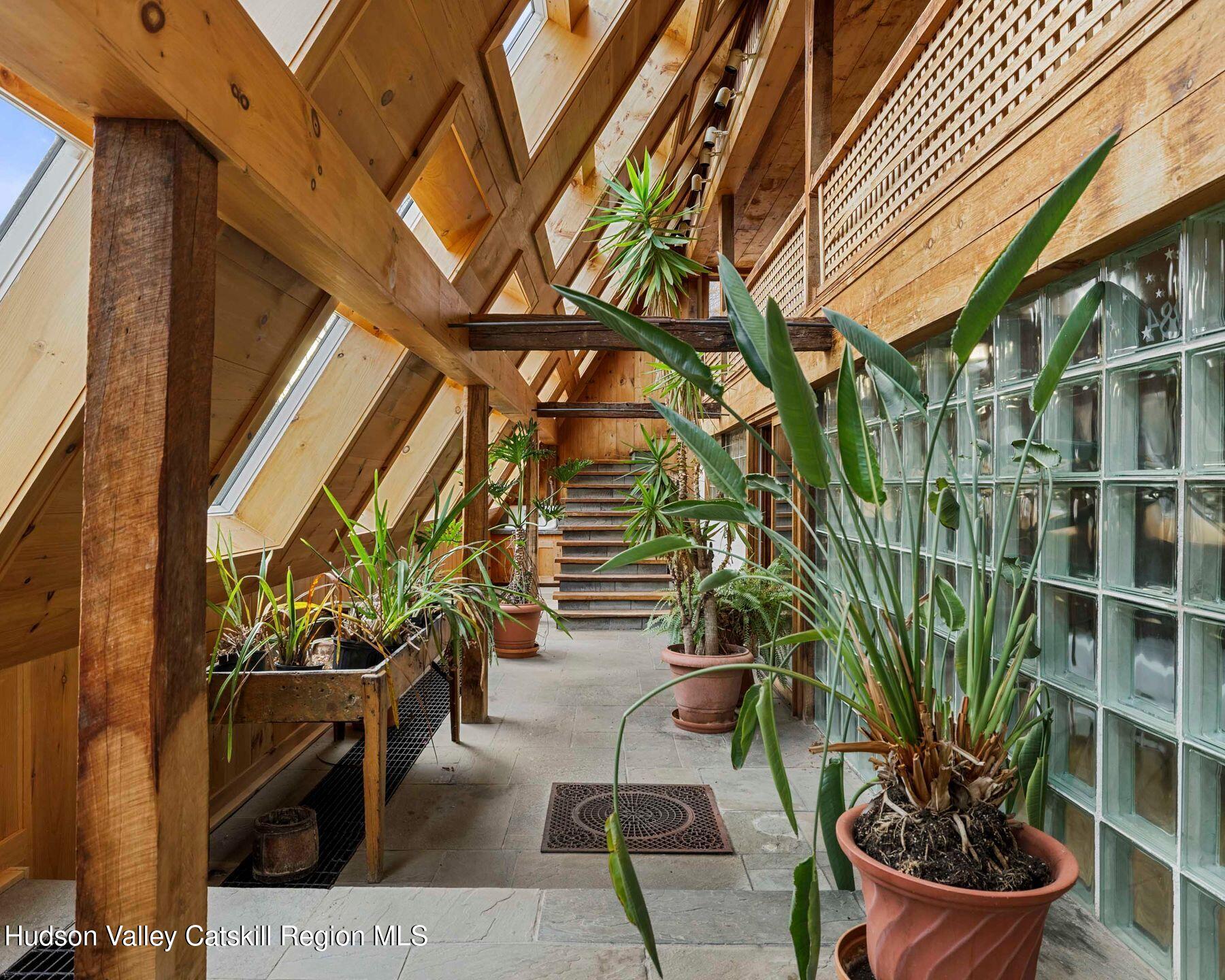 187 Beaver Hill Road Conesville, NY 12076 - Photo 33 of 79 a potted plant sitting in front of a building