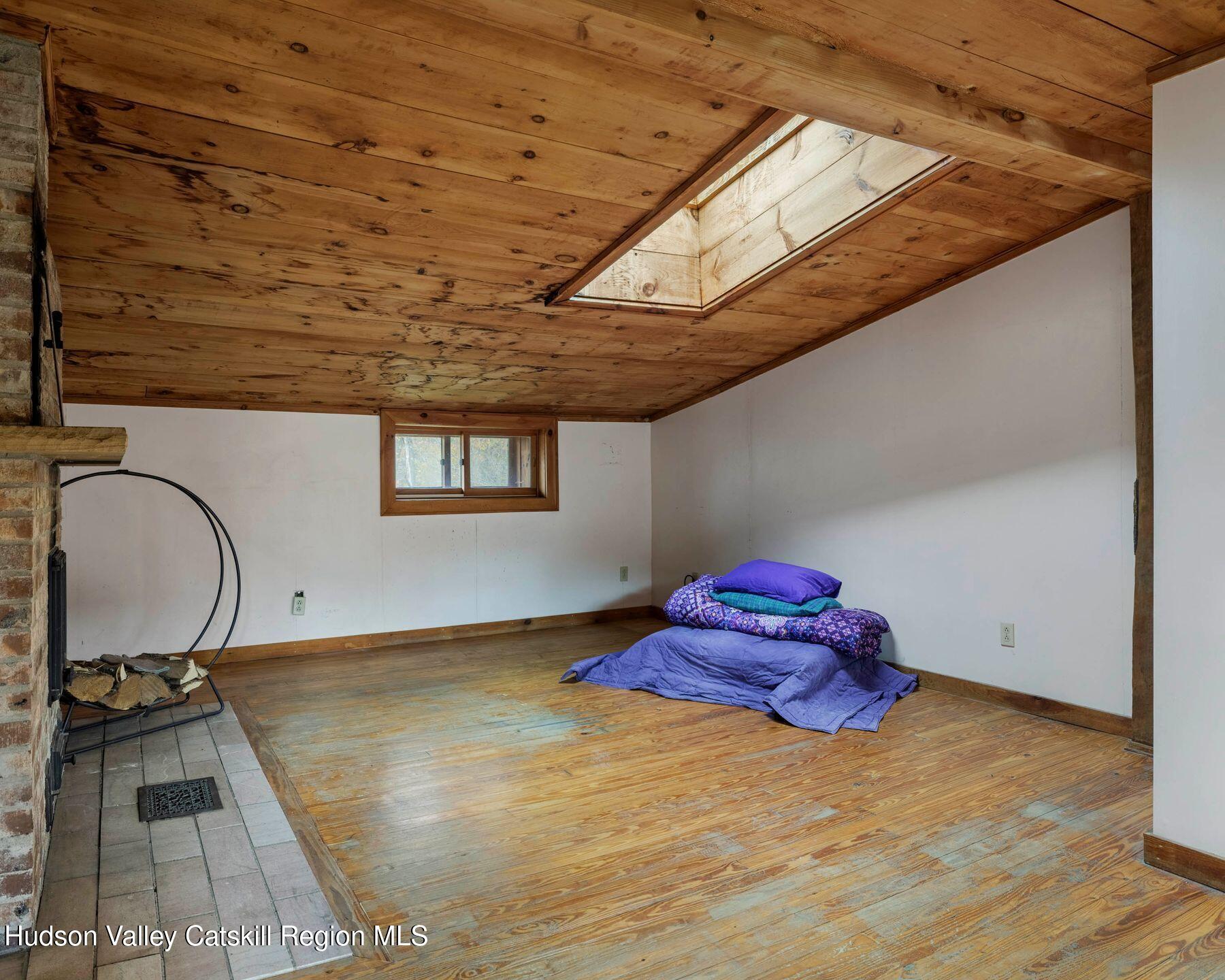 187 Beaver Hill Road Conesville, NY 12076 - Photo 49 of 79 a room with a bed and a table