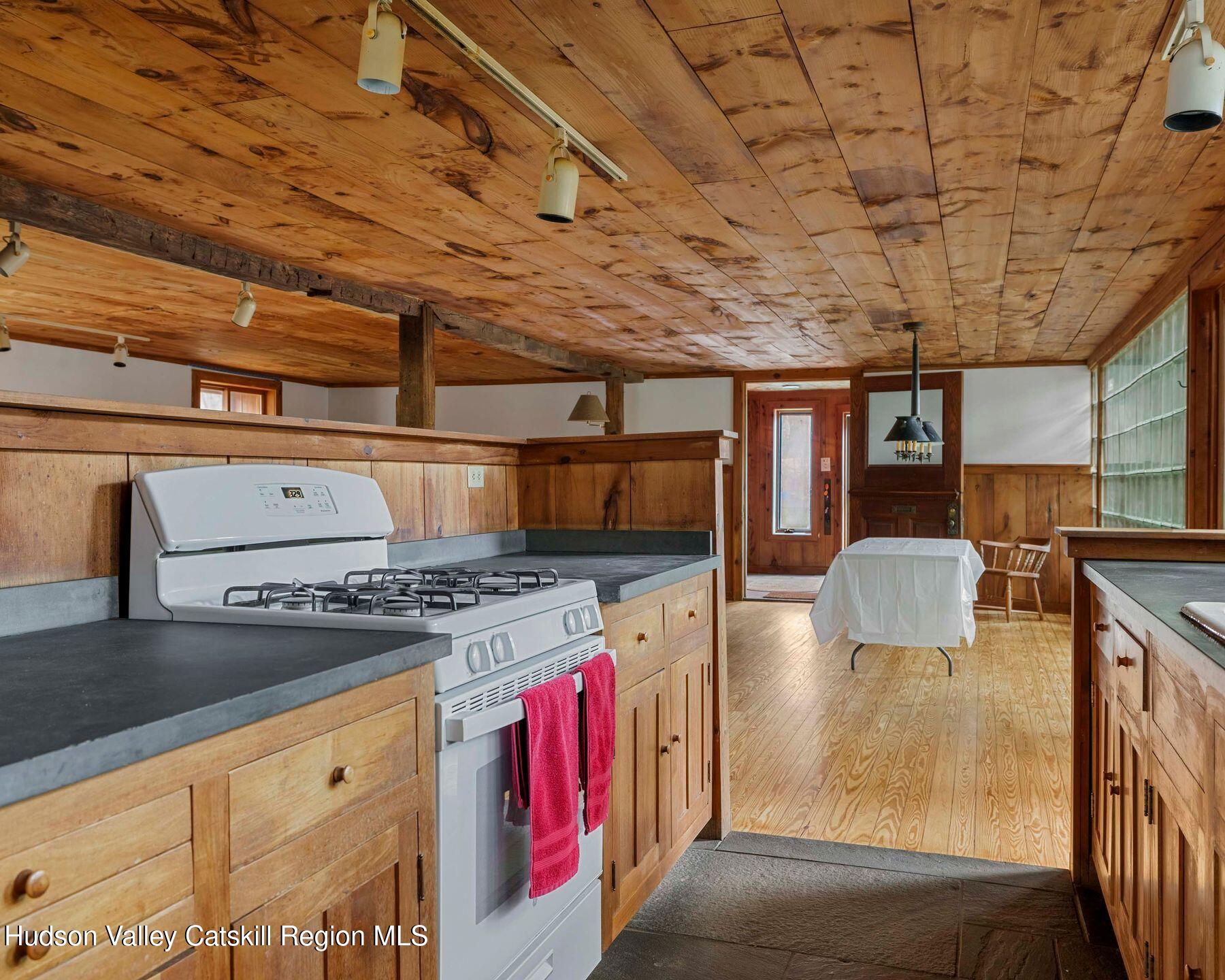 187 Beaver Hill Road Conesville, NY 12076 - Photo 58 of 79 a kitchen with a stove and cabinets