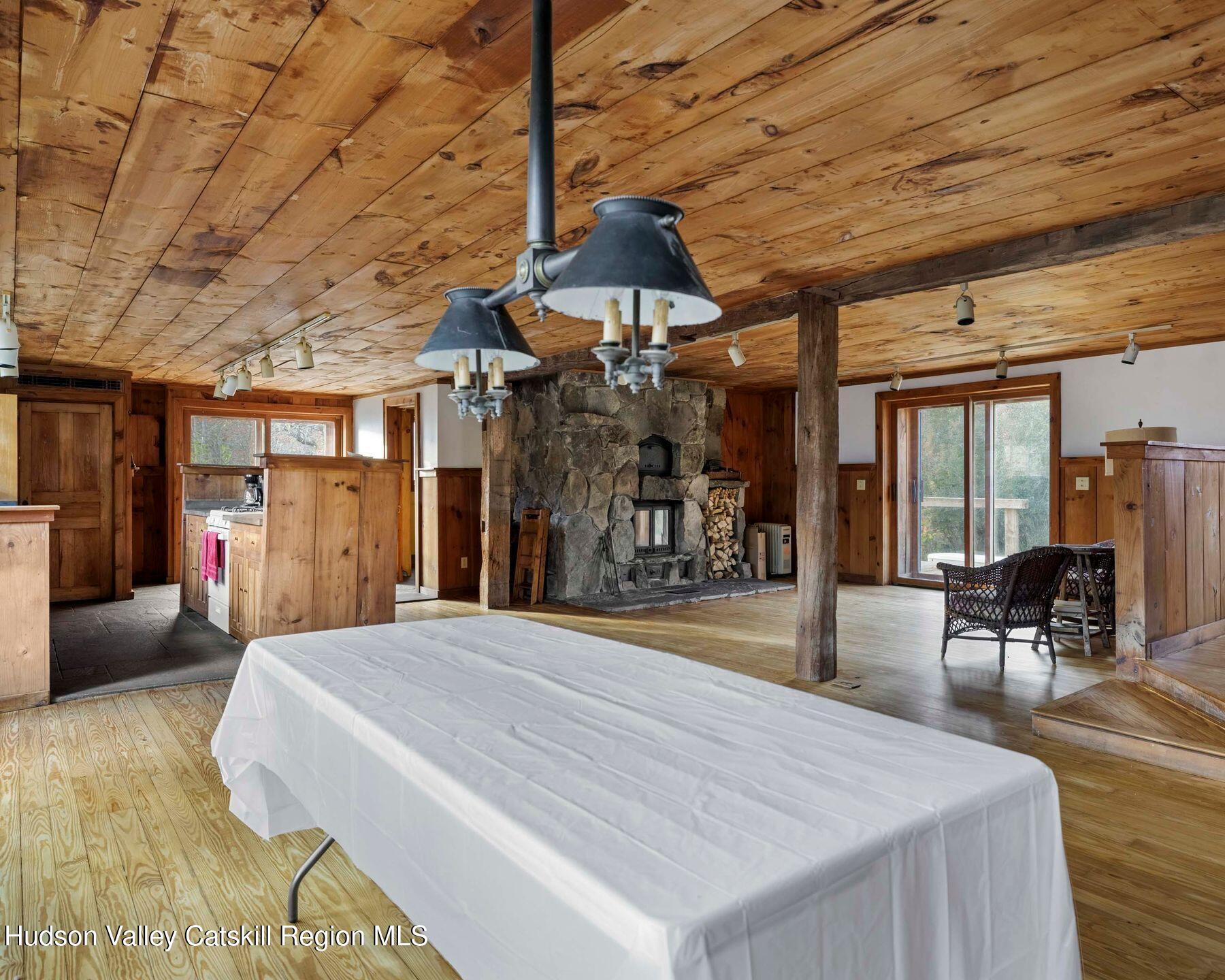 187 Beaver Hill Road Conesville, NY 12076 - Photo 66 of 79 a bedroom with a bed and wooden floor