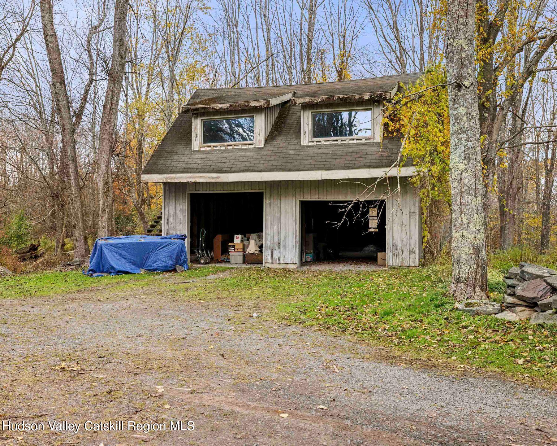 187 Beaver Hill Road Conesville, NY 12076 - Photo 75 of 79 a front view of a house with a yard and trees