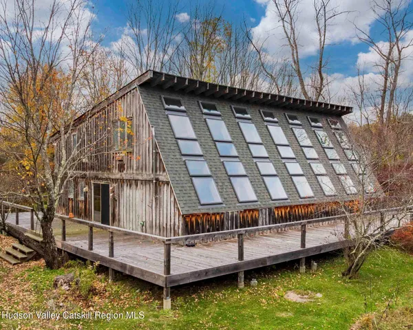 a view of a door and chair in the balcony