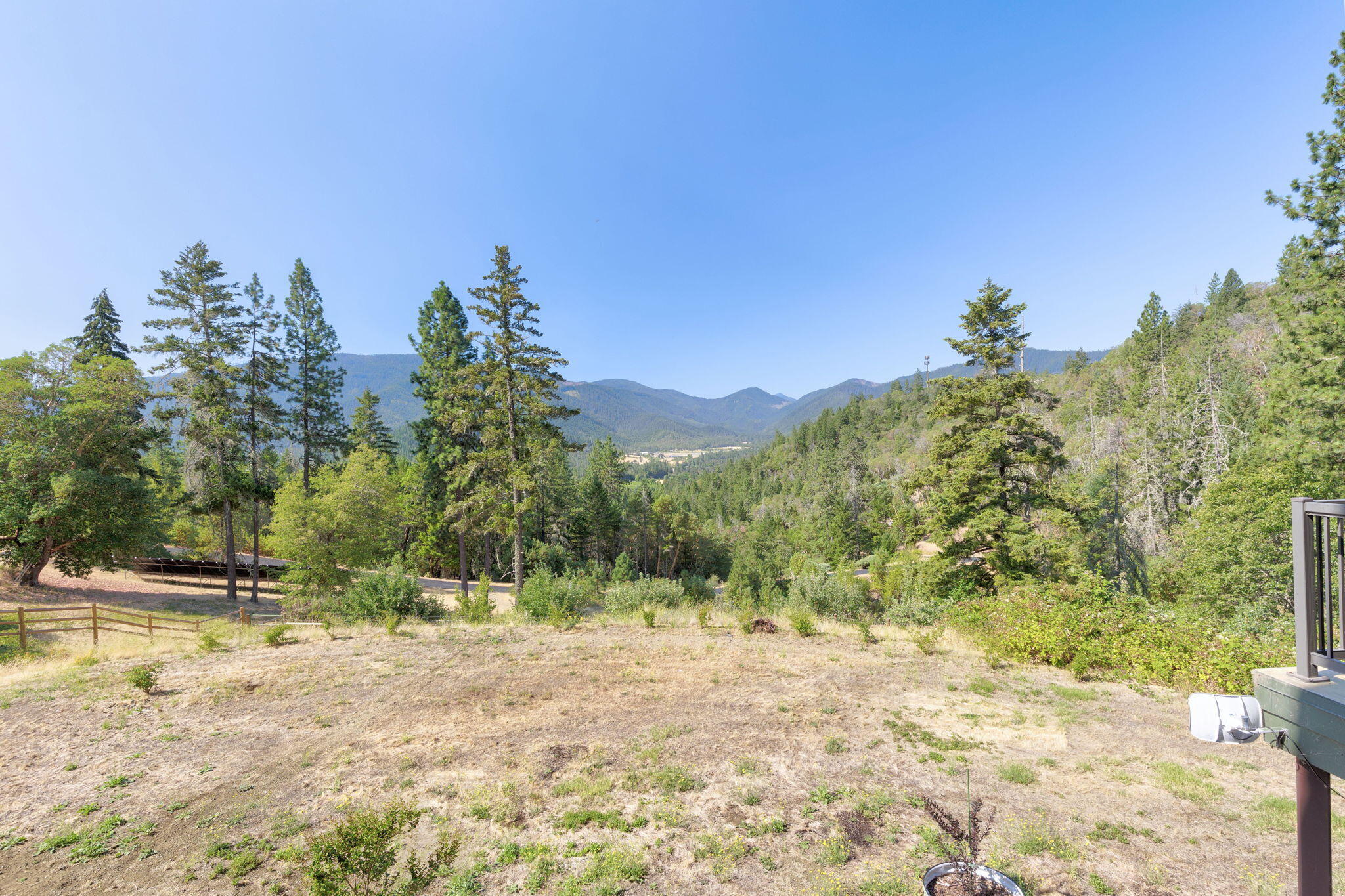 7304 North Applegate Road Grants Pass, OR 97527 - Photo 63 of 87 a view of a yard with a tree