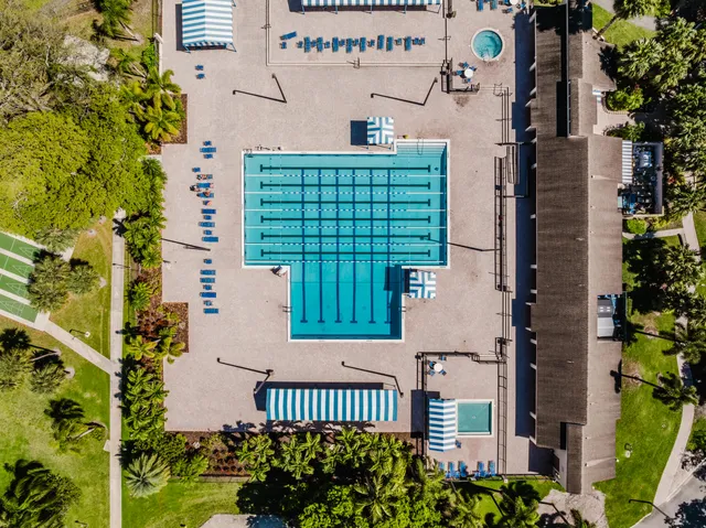 a view of a swimming pool with a lounge chair