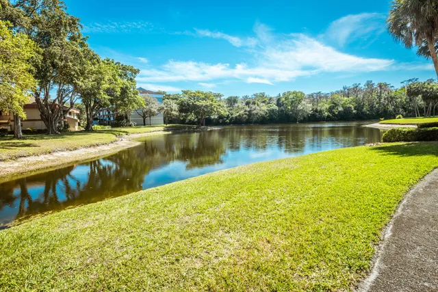 a room with gym equipment and a large mirror