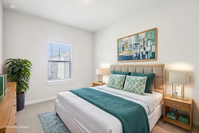 a bedroom with bed and a window