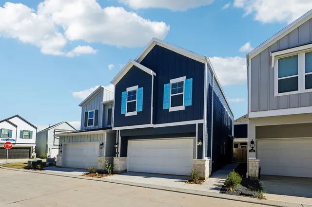 a front view of a house with garage