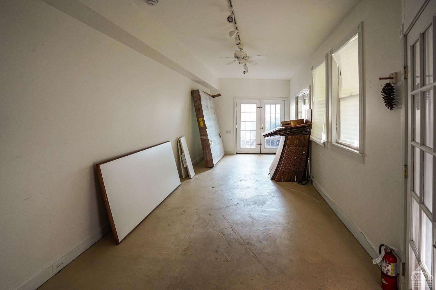 438 Warren Street Hudson, NY 12534 - Photo 11 of 21 a view of a hallway with furniture and a window