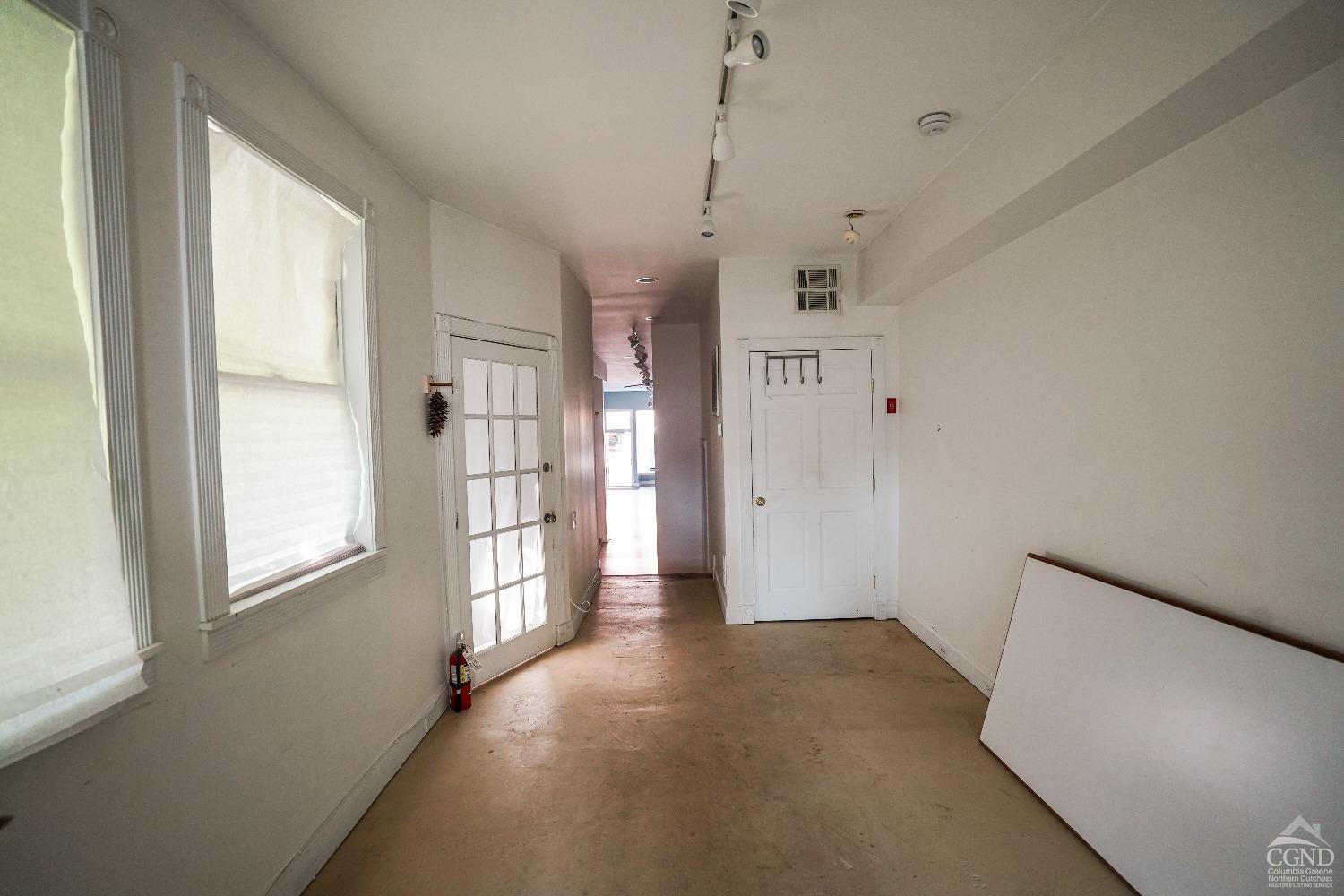 438 Warren Street Hudson, NY 12534 - Photo 12 of 21 a view of empty room with windows