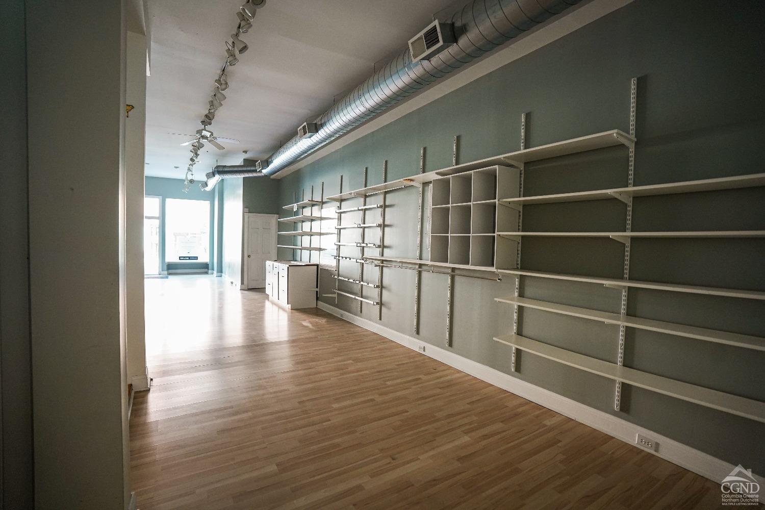 438 Warren Street Hudson, NY 12534 - Photo 13 of 21 a view of a room with wooden floor and windows
