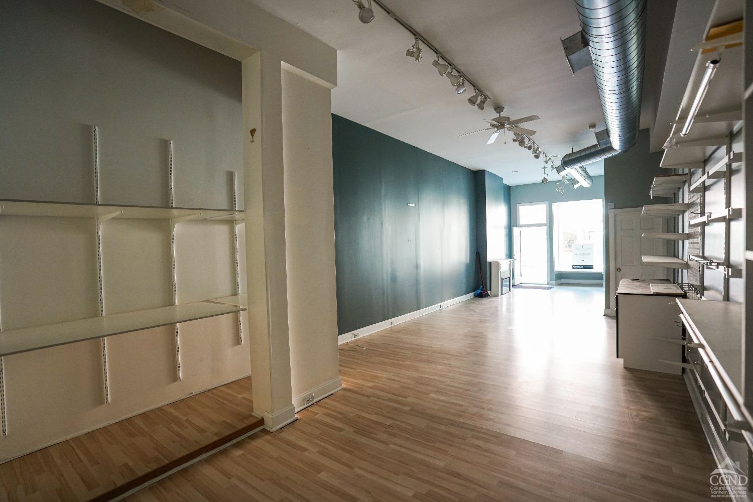 438 Warren Street Hudson, NY 12534 - Photo 15 of 21 a view of a hallway with wooden floor