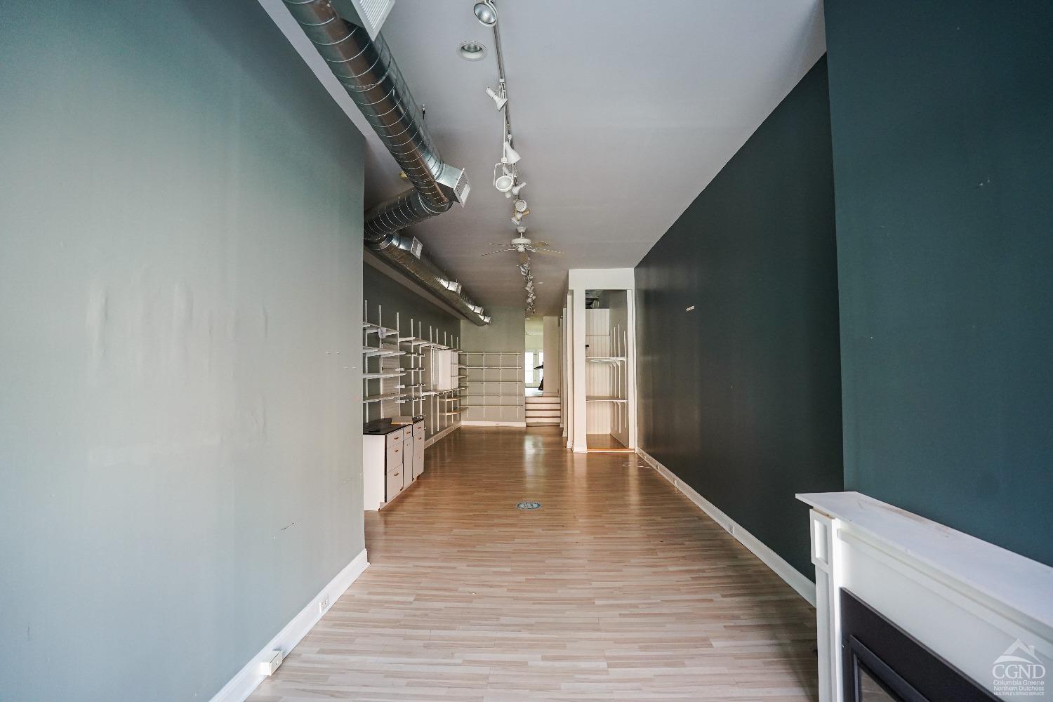 438 Warren Street Hudson, NY 12534 - Photo 5 of 21 a hallway with wooden floor