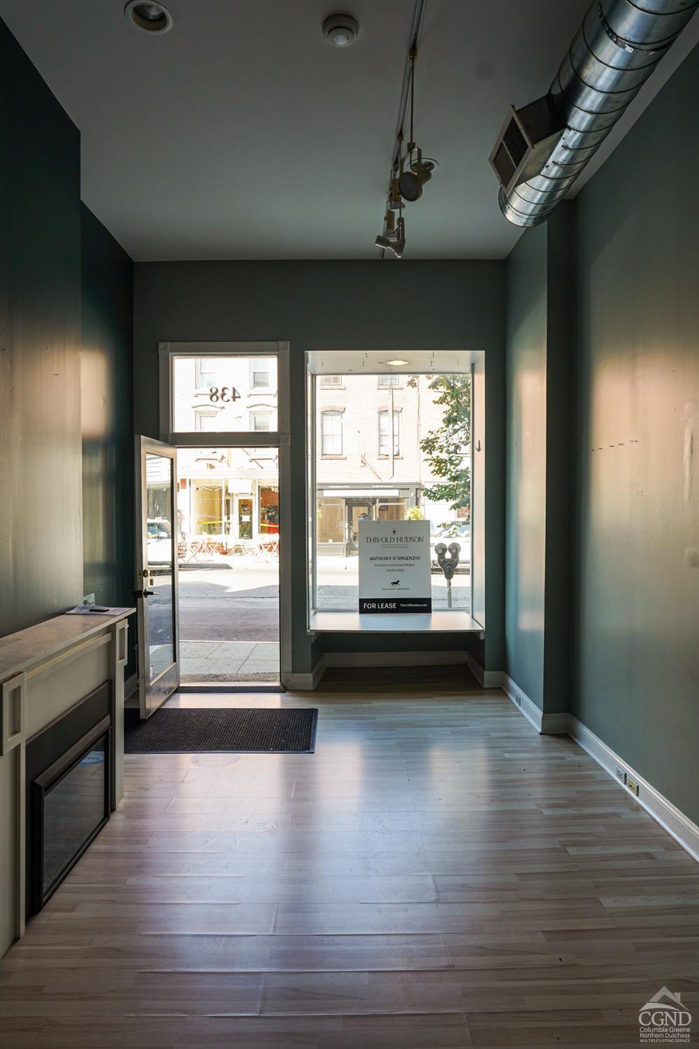 438 Warren Street Hudson, NY 12534 - Photo 6 of 21 a view of a room with window wooden floor and door