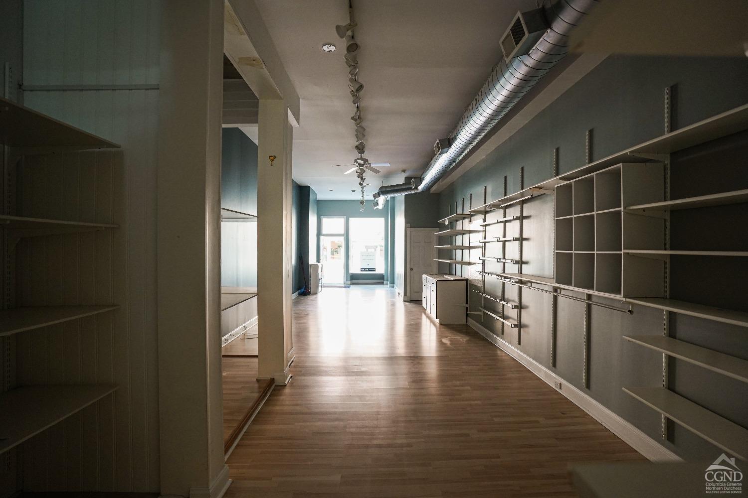 438 Warren Street Hudson, NY 12534 - Photo 8 of 21 a view of interior space with wooden floor and windows