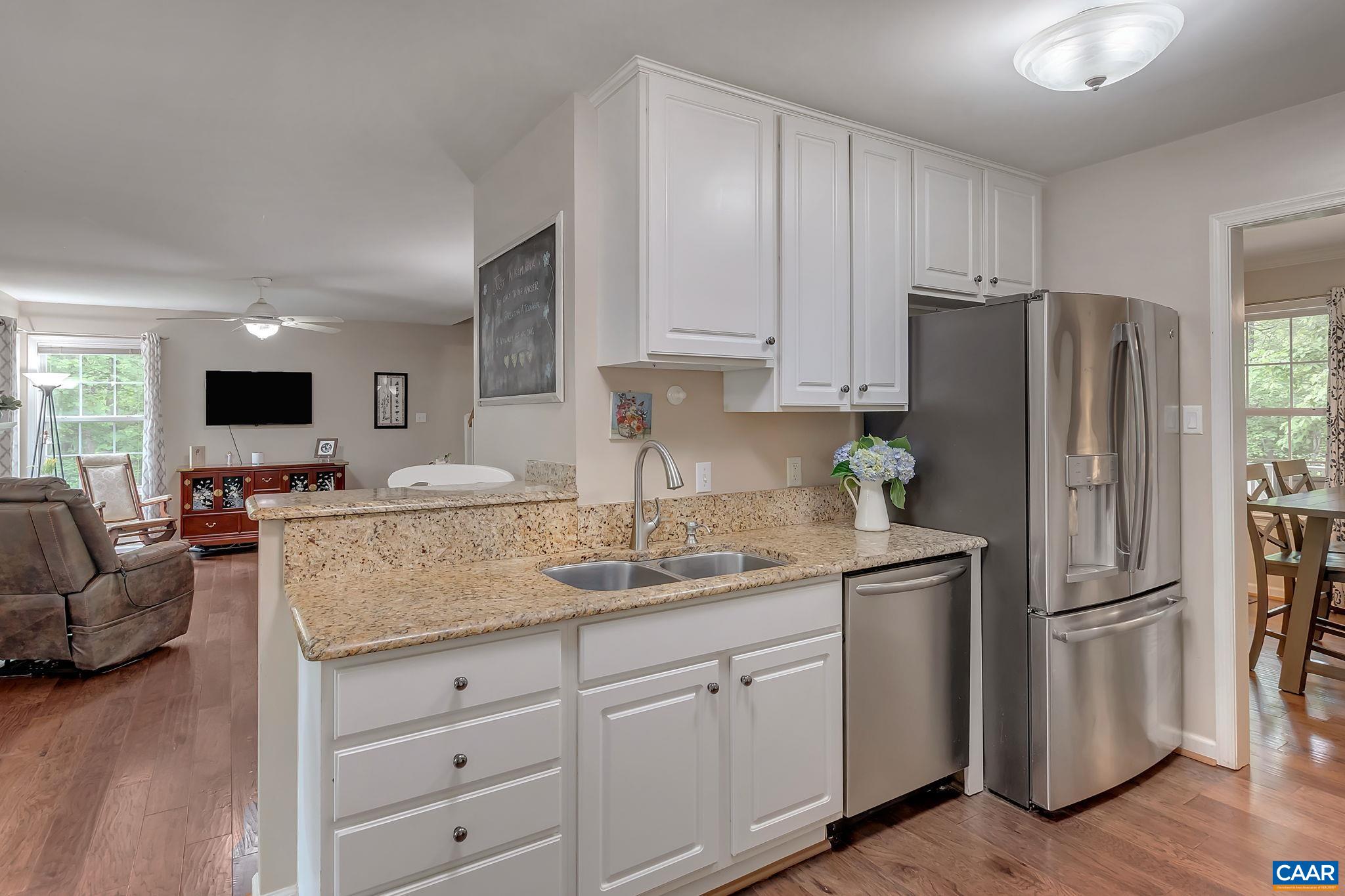 460 Northridge Road Ruckersville, VA 22968 - Photo 12 of 40 a kitchen with granite countertop a refrigerator and a sink