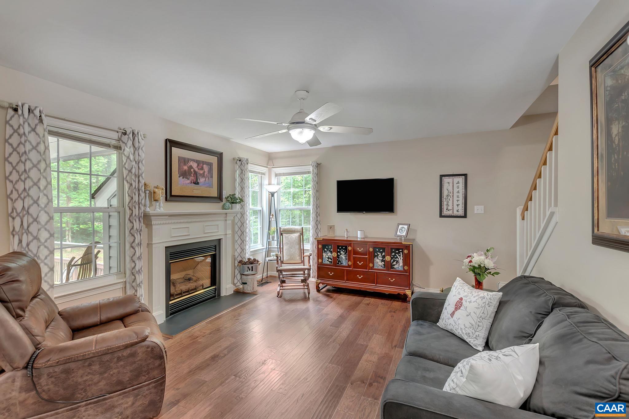 460 Northridge Road Ruckersville, VA 22968 - Photo 15 of 40 a living room with furniture a flat screen tv and a fireplace