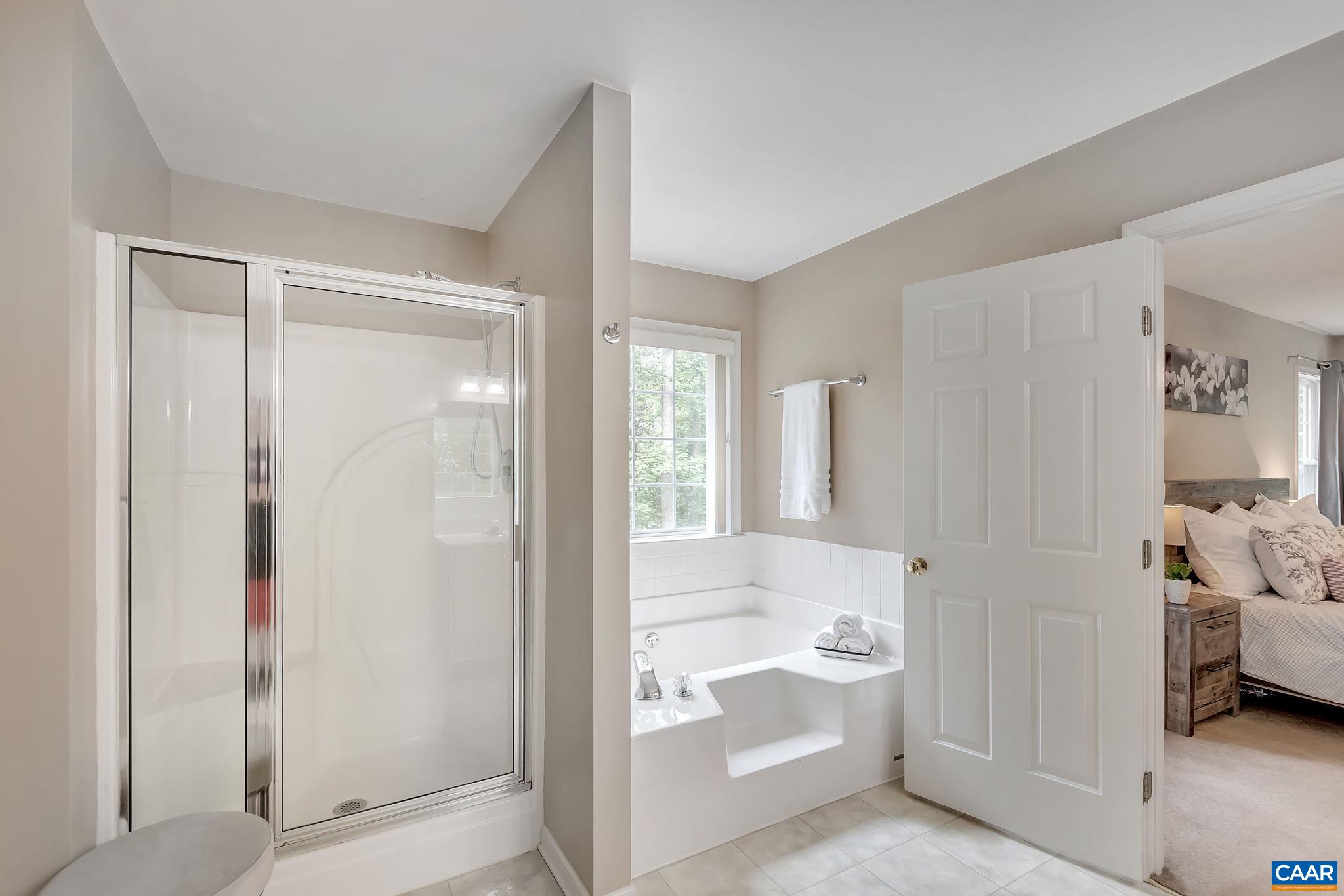 460 Northridge Road Ruckersville, VA 22968 - Photo 17 of 40 a bathroom with a tub and a shower