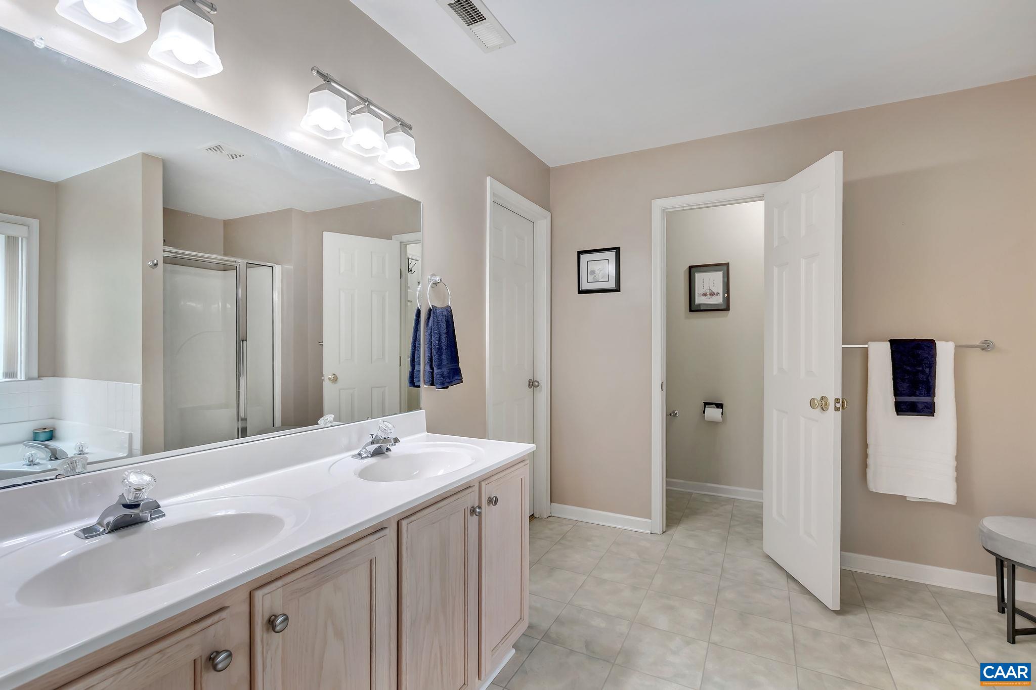 460 Northridge Road Ruckersville, VA 22968 - Photo 18 of 40 a bathroom with a double vanity sink and a mirror