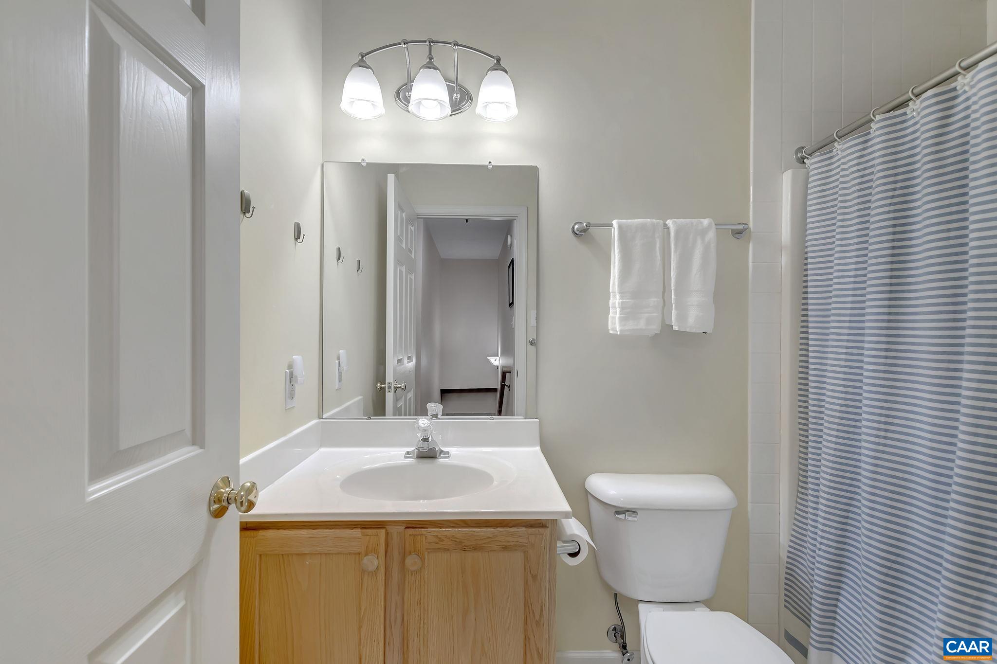 460 Northridge Road Ruckersville, VA 22968 - Photo 21 of 40 a bathroom with a toilet sink and mirror
