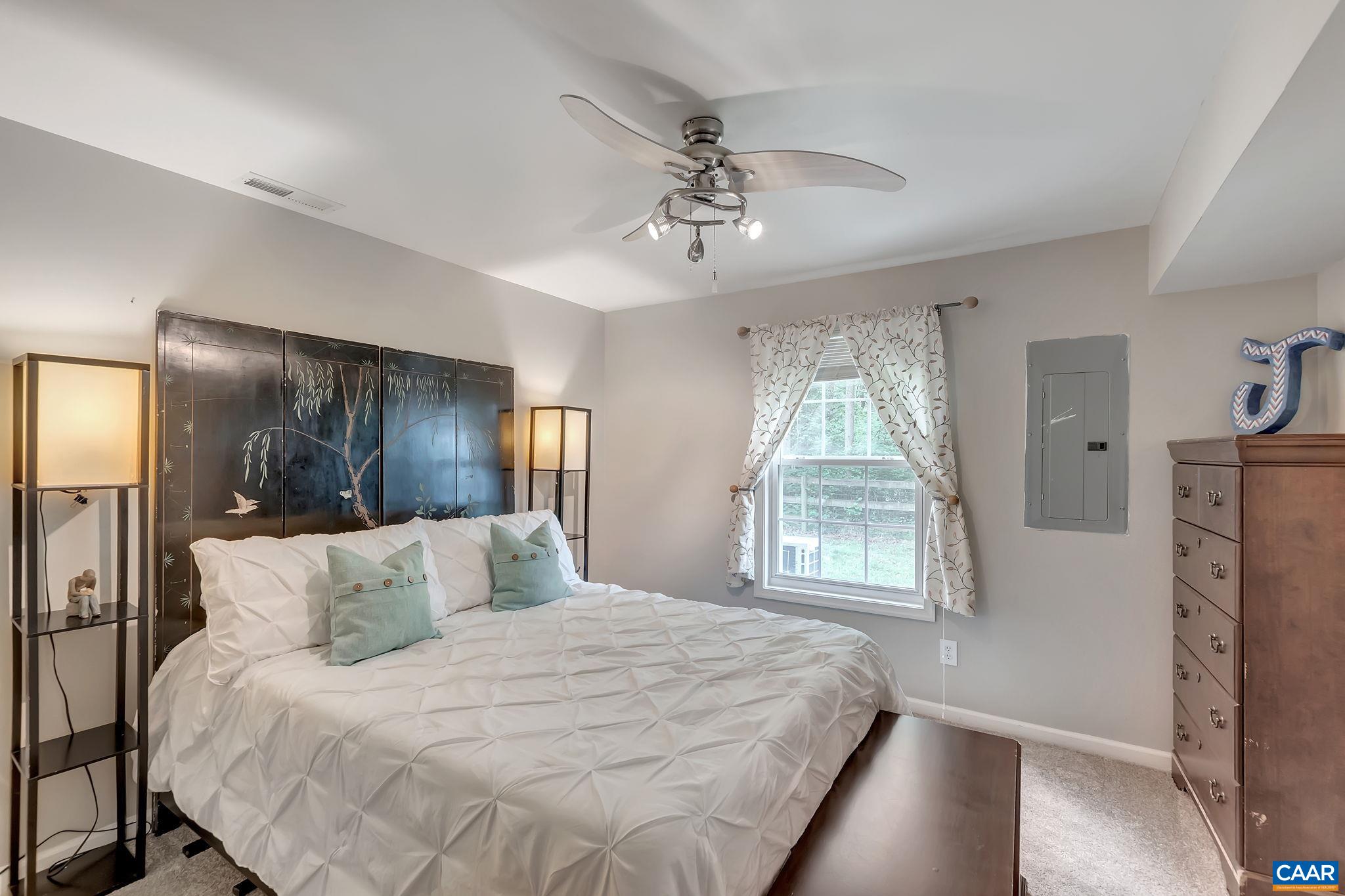 460 Northridge Road Ruckersville, VA 22968 - Photo 24 of 40 a bedroom with a large bed and a window