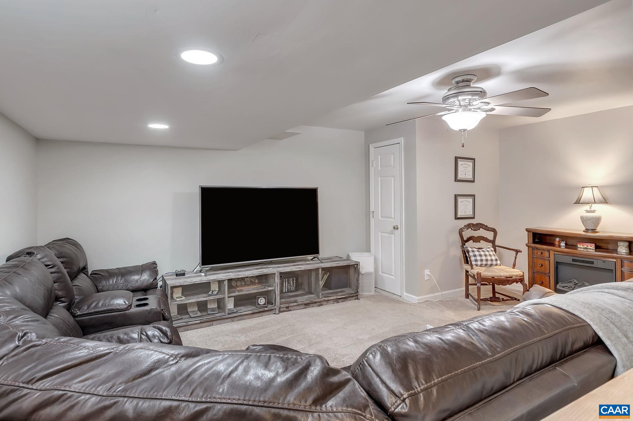 460 Northridge Road Ruckersville, VA 22968 - Photo 25 of 40 a living room with furniture and a flat screen tv