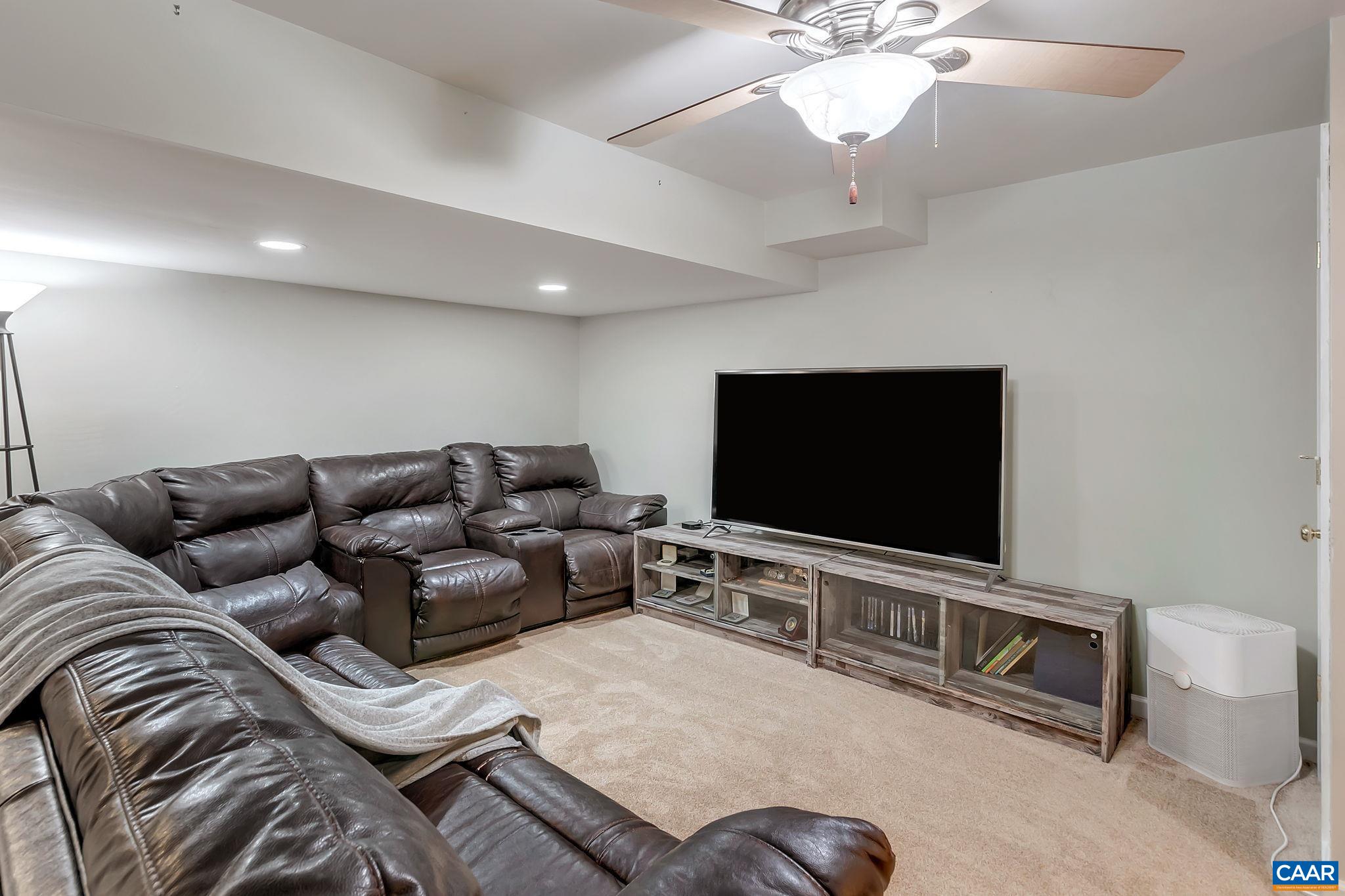 460 Northridge Road Ruckersville, VA 22968 - Photo 26 of 40 a living room with furniture and a flat screen tv