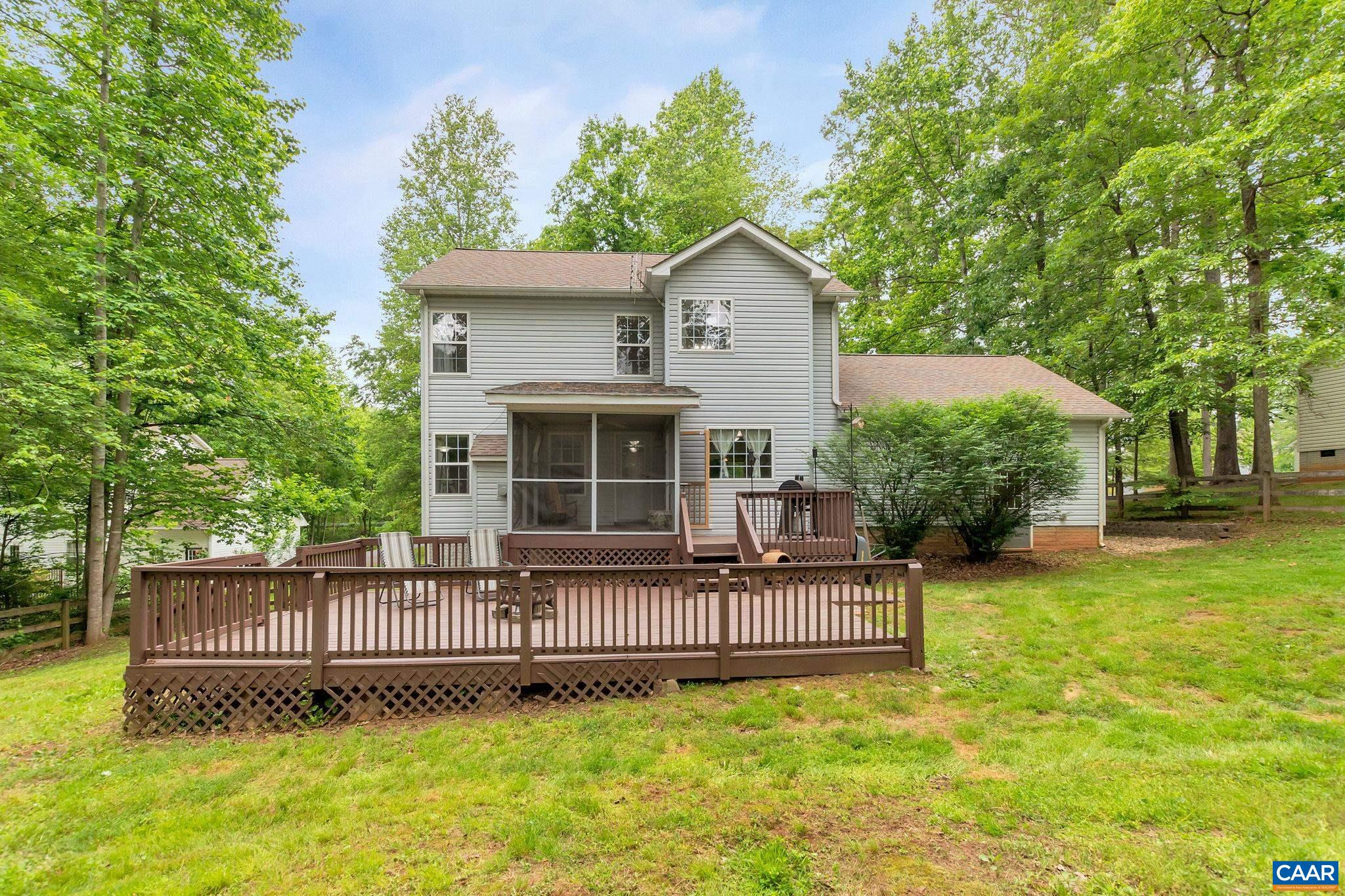460 Northridge Road Ruckersville, VA 22968 - Photo 30 of 40 a view of a house with a yard and deck