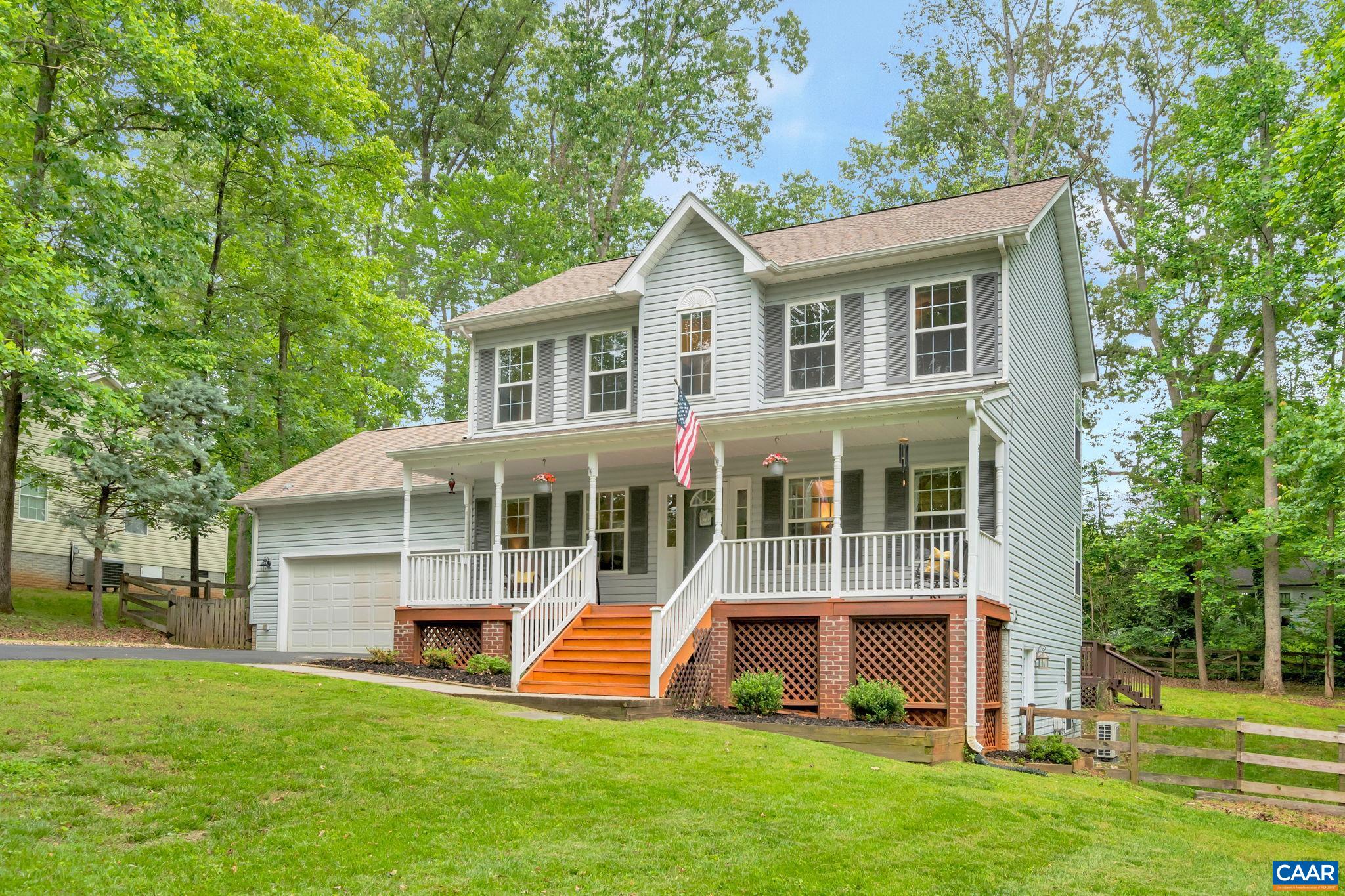 460 Northridge Road Ruckersville, VA 22968 - Photo 34 of 40 a front view of a house with a yard and trees