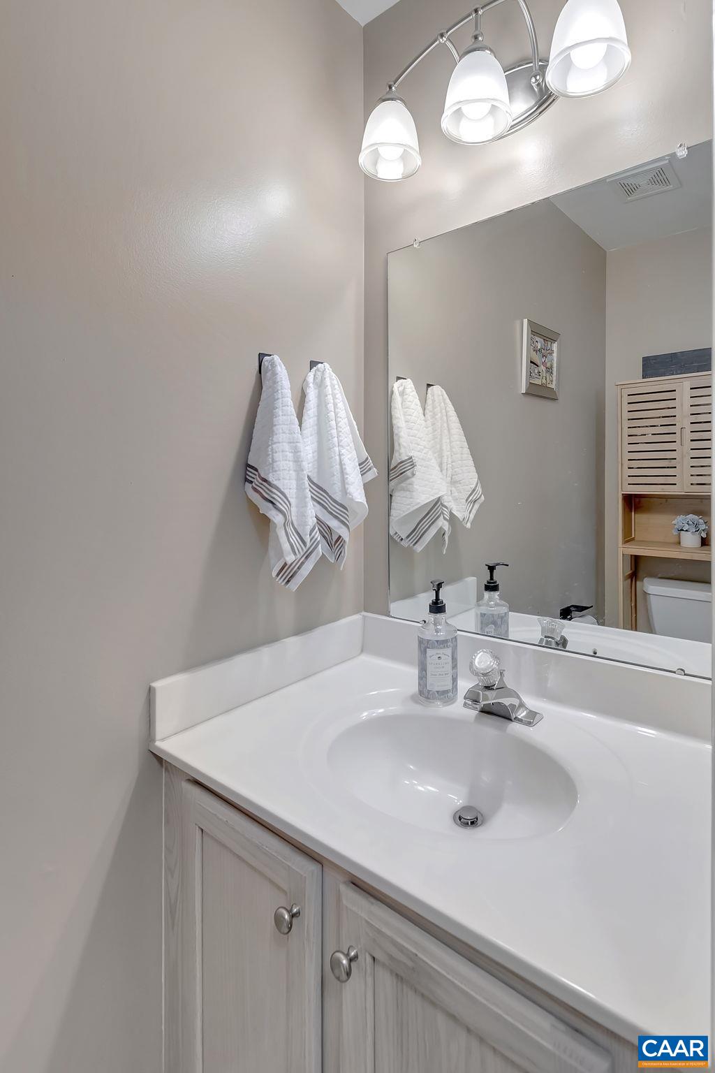 460 Northridge Road Ruckersville, VA 22968 - Photo 38 of 40 a bathroom with a sink and a mirror