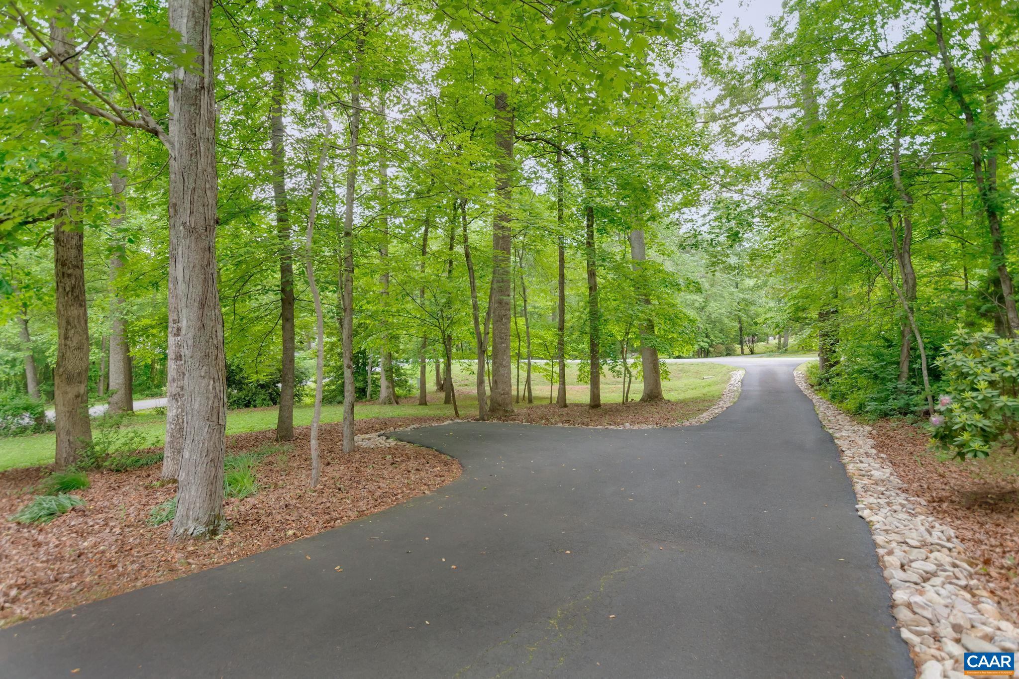 460 Northridge Road Ruckersville, VA 22968 - Photo 4 of 40 a view of a road with a trees in the background